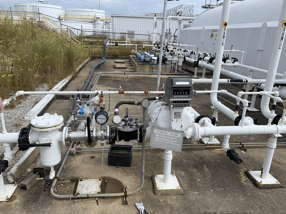 piping with various elements next to ast tanks