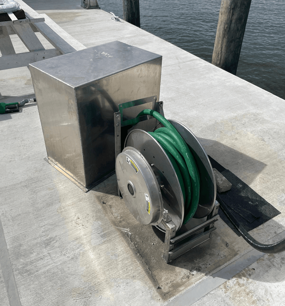 hose retractor on dock with cover next to it