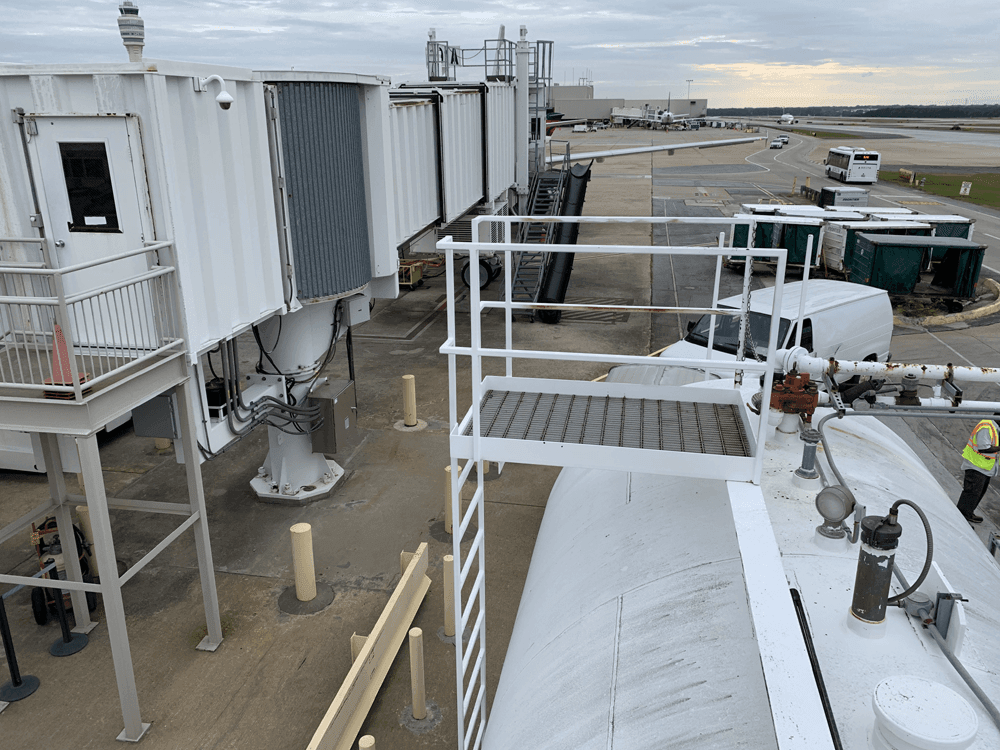 top of ast next to passenger boarding bridge at embarking gate